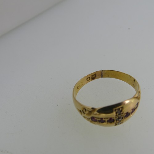 78 - A 9ct yellow gold Ring, the front with two gypsy set rubies and seed pearl centre, engraved shoulder... 