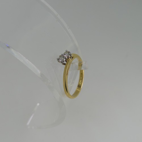 91 - A two stone diamond Ring, set on the cross in 18ct yellow and white gold, each stone approx 0.075ct,... 