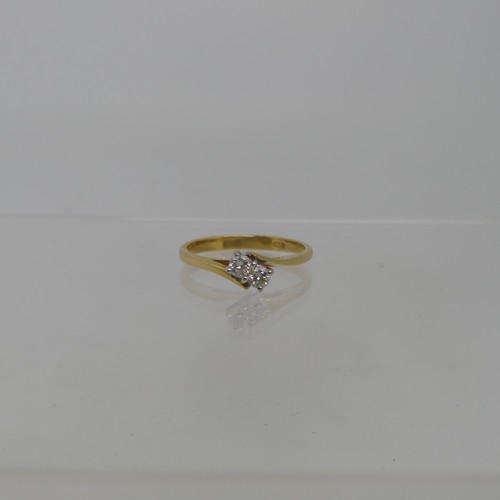 91 - A two stone diamond Ring, set on the cross in 18ct yellow and white gold, each stone approx 0.075ct,... 