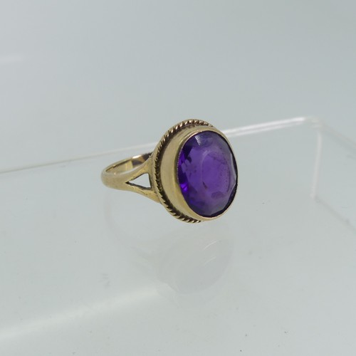 101 - An oval facetted amethyst Ring, mounted in 9ct gold, Size K½, approx total weight 4g, together with ... 