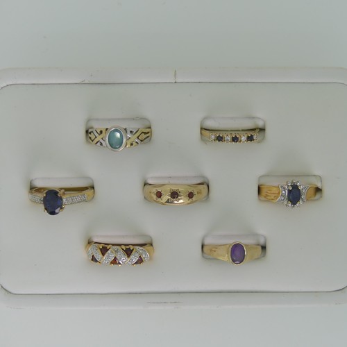 102 - A small amethyst Ring, collet set in 9ct gold, Size M, together with three other 9ct gold rings, var... 