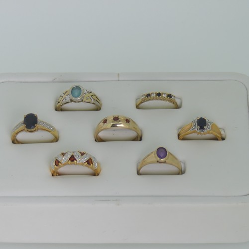 102 - A small amethyst Ring, collet set in 9ct gold, Size M, together with three other 9ct gold rings, var... 