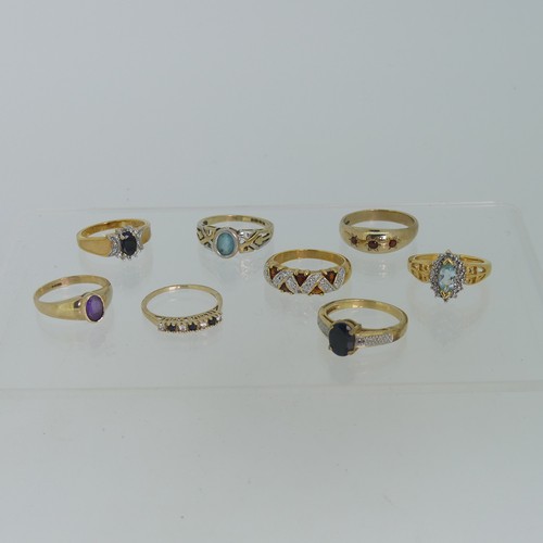 102 - A small amethyst Ring, collet set in 9ct gold, Size M, together with three other 9ct gold rings, var... 