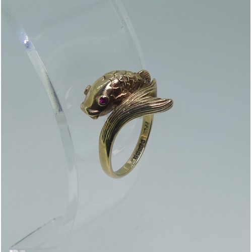 88 - A 9ct gold Dolphin Ring, the head and tail crossing over at the front, with ruby eyes, Size N, 3.8g.... 