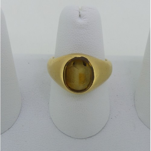 90 - A citrine Signet Ring, the oval stone mounted in unmarked yellow gold, tested as 18ct, Size O½, appr... 