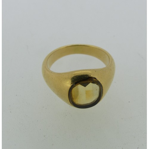 90 - A citrine Signet Ring, the oval stone mounted in unmarked yellow gold, tested as 18ct, Size O½, appr... 