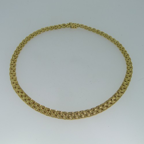 122 - An 18ct yellow gold Collar Necklace, with slightly graduated fancy links, the front 7mm wide, the in... 