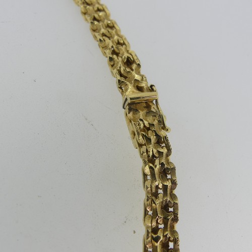 122 - An 18ct yellow gold Collar Necklace, with slightly graduated fancy links, the front 7mm wide, the in... 