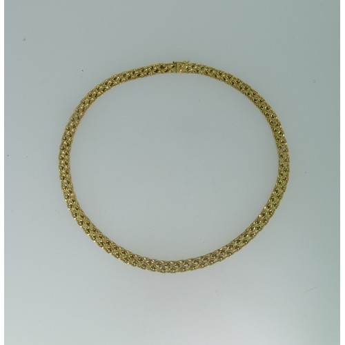 122 - An 18ct yellow gold Collar Necklace, with slightly graduated fancy links, the front 7mm wide, the in... 