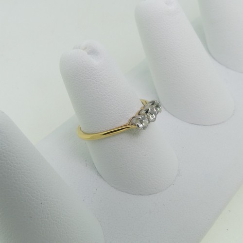 66 - A small three stone diamond Ring, the unmarked yellow gold shank tested as 18ct gold, Size O, approx... 