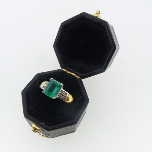 94 - An 18ct yellow gold and emerald Ring, the emerald cut stone claw set in white gold with four small d... 