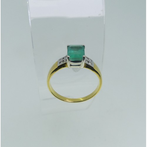 94 - An 18ct yellow gold and emerald Ring, the emerald cut stone claw set in white gold with four small d... 