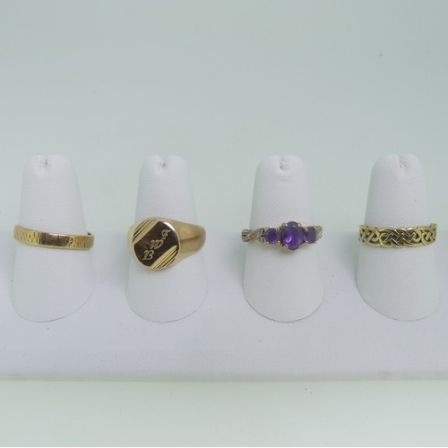 92 - Three 9ct gold Rings; one a textured band, Size O½, one set amethysts, Size O, one with knot front, ... 