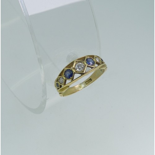 104 - A graduated seven stone sapphire and diamond Ring, the central diamond approx. 0.1ct, all mounted in... 