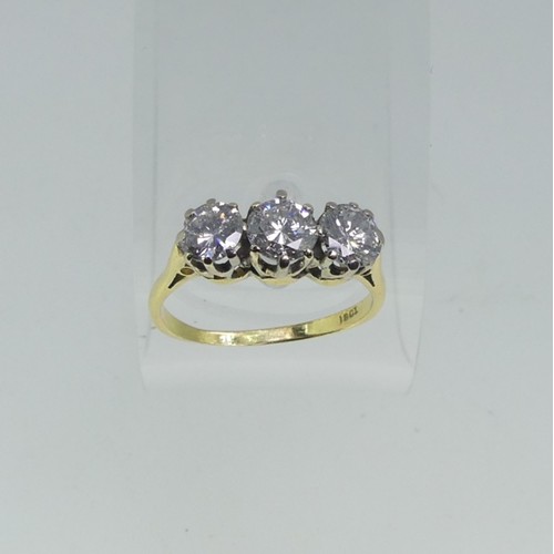 114 - A three stone Diamond Ring, the circular cut centre stone approx 0.56ct, with  a circular cut stone ... 