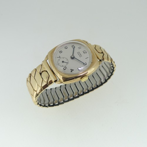 34 - A 9ct gold Buren Grand Prix cushion cased gentleman's Wristwatch, the silvered dial with Arabic nume... 