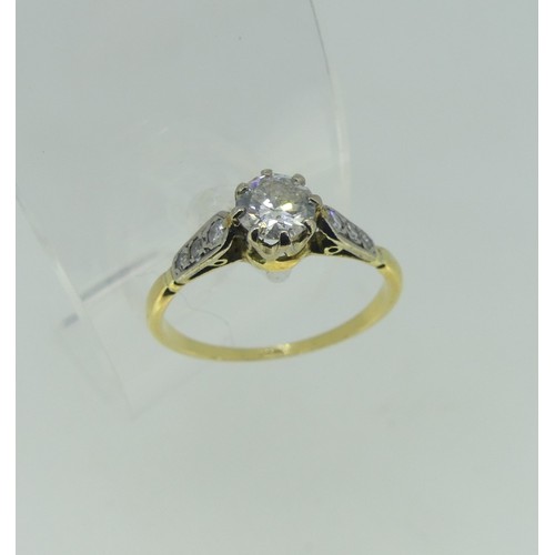 115 - A single stone diamond Ring, the circular cut stone approx 0.52ct, with three graduated small diamon... 