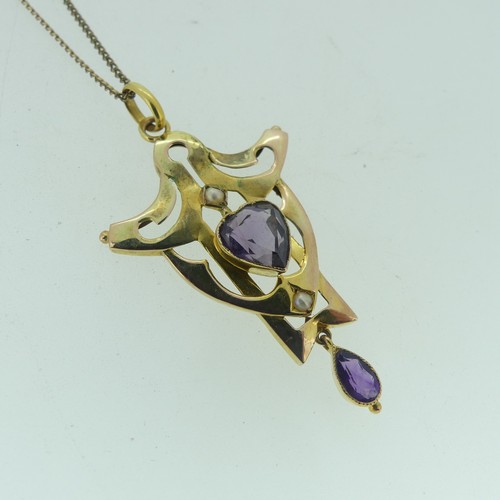 124 - A 9ct yellow gold amethyst and seed pearl Pendant, in the Art Nouveau style, with central heart shap... 