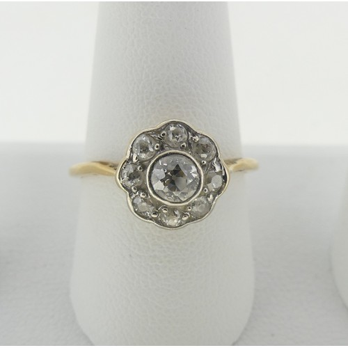 93 - A diamond Cluster Ring, the central old cut stone approx ¼ct, surrounded by eight smaller stones, al... 