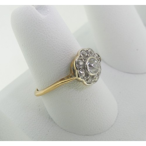 93 - A diamond Cluster Ring, the central old cut stone approx ¼ct, surrounded by eight smaller stones, al... 