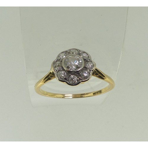 93 - A diamond Cluster Ring, the central old cut stone approx ¼ct, surrounded by eight smaller stones, al... 