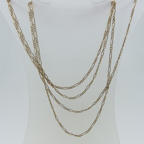 121 - A 15ct yellow gold Guard Chain, the oval links with three smaller circular links between, 152cm long... 