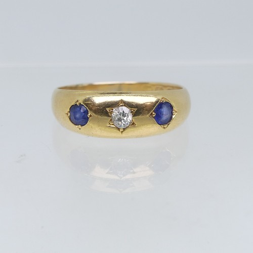 111 - An 18ct yellow gold Band, gypsy set with two sapphires and central diamond, the diamond approx 0.1ct... 