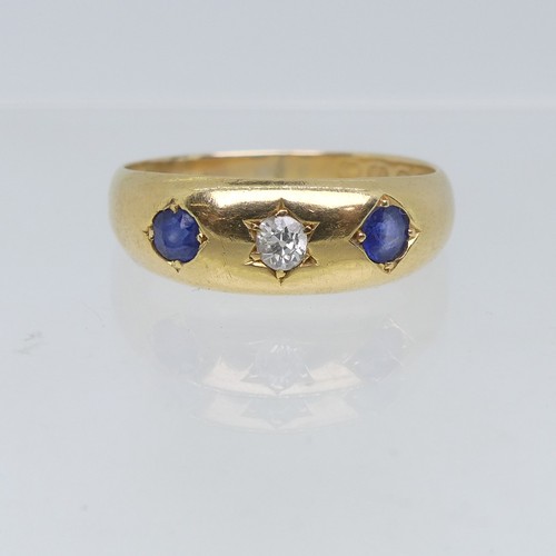 111 - An 18ct yellow gold Band, gypsy set with two sapphires and central diamond, the diamond approx 0.1ct... 