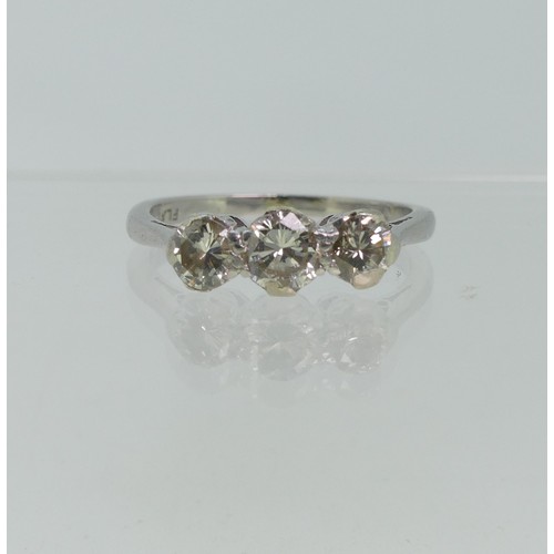 71 - A three stone diamond Ring, the centre stone approx. 0.3ct, with a smaller stone on each side, each ... 