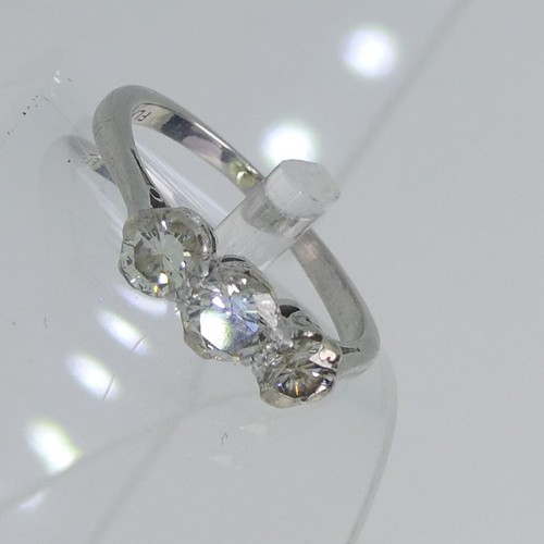 71 - A three stone diamond Ring, the centre stone approx. 0.3ct, with a smaller stone on each side, each ... 