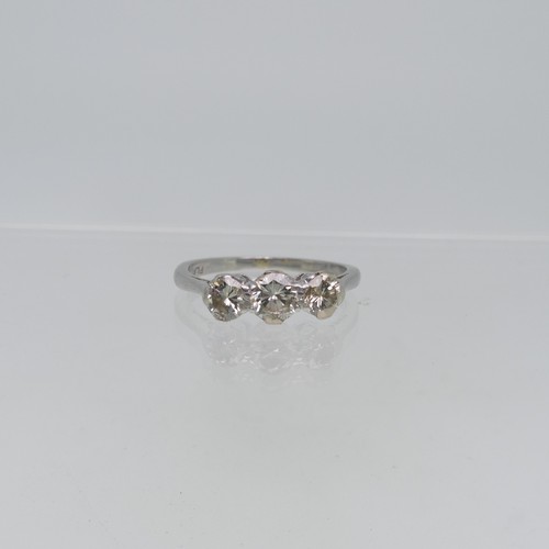 71 - A three stone diamond Ring, the centre stone approx. 0.3ct, with a smaller stone on each side, each ... 