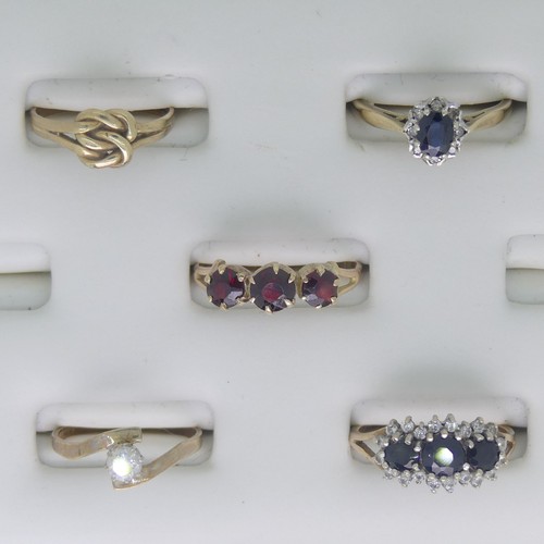 110 - Five 9ct yellow gold Rings; one set three garnets, Size O, one a sapphire and white paste triple clu... 