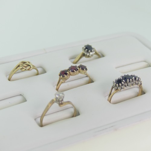 110 - Five 9ct yellow gold Rings; one set three garnets, Size O, one a sapphire and white paste triple clu... 