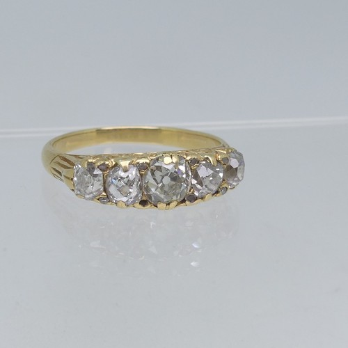 95 - A graduated five stone diamond Ring, the centre stone approx 0.5ct, all mounted in yellow metal in a... 