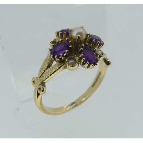 81 - An amethyst and seed pearl flowerhead Ring, mounted in 9ct yellow gold, one seed pearl missing, Size... 