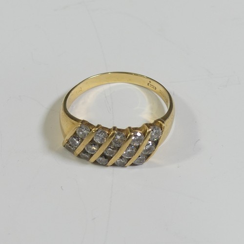 84 - An 18ct yellow gold and diamond Ring, the front with five slanted rows of three diamonds, approx tot... 