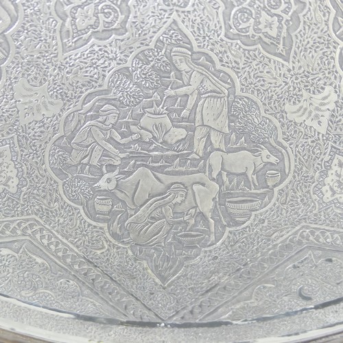 446 - An early 20thC Persian circular silver Tray, decorated with six figural scenes within a scrolling fo... 