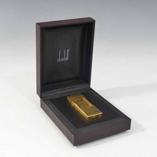 357 - A Dunhill gold plated Cigarette Lighter, leaf design, with original slip case, booklet, guarantee ca... 