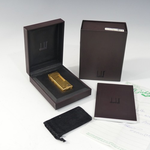 357 - A Dunhill gold plated Cigarette Lighter, leaf design, with original slip case, booklet, guarantee ca... 