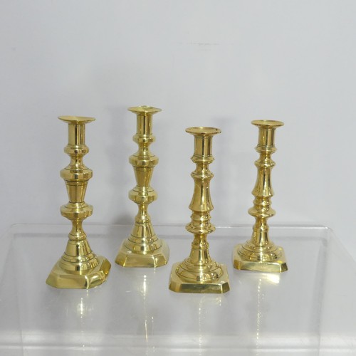 372 - Two pairs antique turned brass Candlesticks, on square and hexagonal bases, dents to sconce, Highest... 