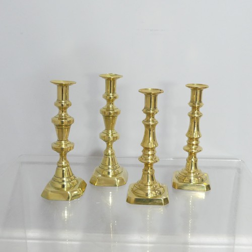 372 - Two pairs antique turned brass Candlesticks, on square and hexagonal bases, dents to sconce, Highest... 