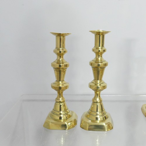 372 - Two pairs antique turned brass Candlesticks, on square and hexagonal bases, dents to sconce, Highest... 