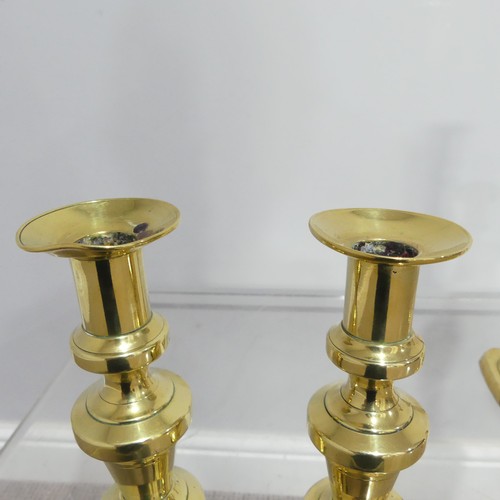 372 - Two pairs antique turned brass Candlesticks, on square and hexagonal bases, dents to sconce, Highest... 