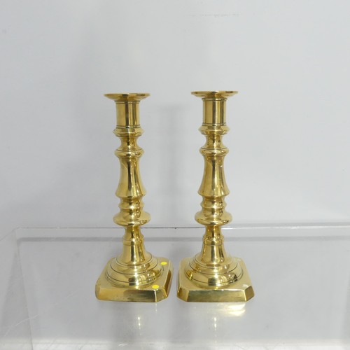 372 - Two pairs antique turned brass Candlesticks, on square and hexagonal bases, dents to sconce, Highest... 