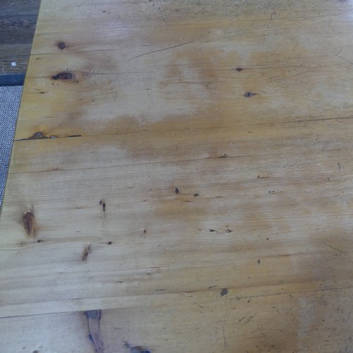 382 - A pine farmhouse Kitchen Table, with rounded corners, on turned legs, some mouse damage to one leg, ... 