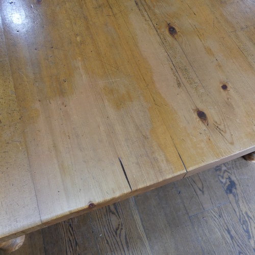 382 - A pine farmhouse Kitchen Table, with rounded corners, on turned legs, some mouse damage to one leg, ... 