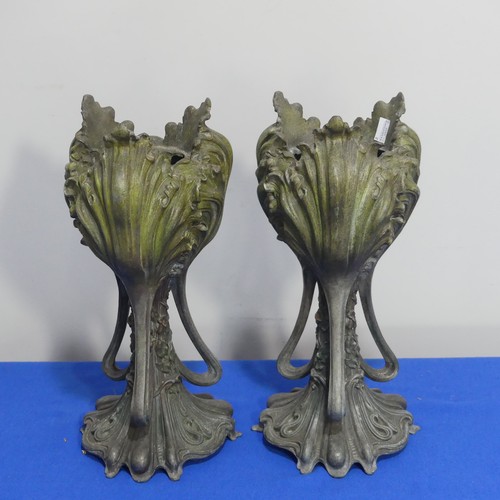 407 - A pair of Art Nouveau spelter Vases, of three handled form, moulded with floral decoration on shaped... 