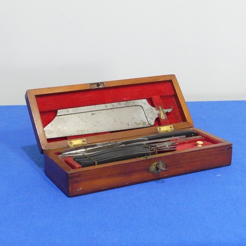 414 - A 19thC mahogany cased Surgeons amputation Set, the set with a detachable steel saw, blades, tweezer... 