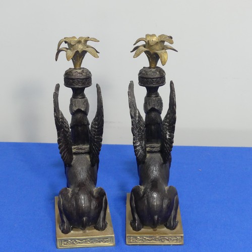 416 - A pair of 19thc style classical Candlesticks, each modelled as a gryphon, on brass base, H 27cm.... 