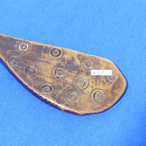 422 - An antique Tribal carved wooden Spoon or Scoop, probably African, carved with geometric circles and ... 